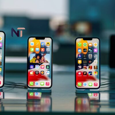 Varios modelos de iPhone en fila con pantallas encendidas, ofreciendo una guía visual sobre qué iPhone elegir.