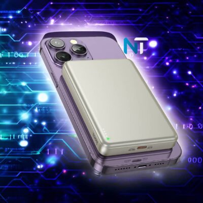 Batería externa MagSafe Hoco Q26A de color plata acoplada a un iPhone morado sobre un fondo de circuitos digitales.